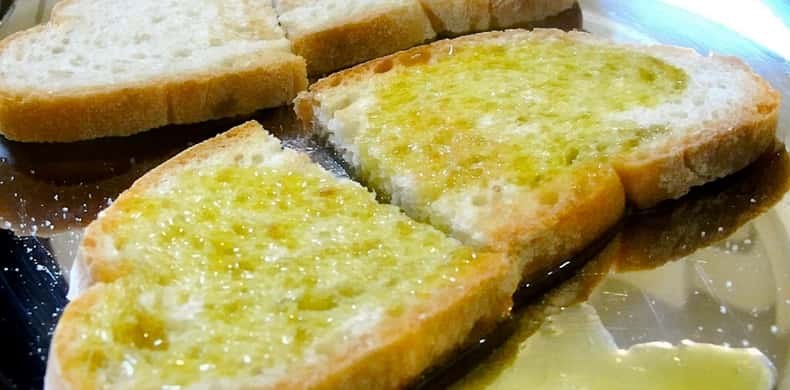 Bread toasted and dressed with new green olive oil